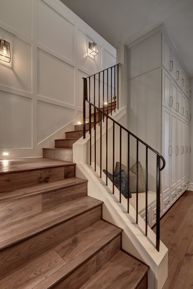 Example of a large transitional wooden l-shaped staircase design in Austin with wooden risers