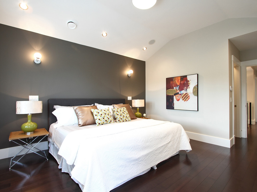 Contemporary bedroom in Vancouver with grey walls and dark hardwood floors.