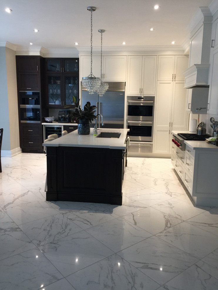 Example of a transitional kitchen design in Toronto