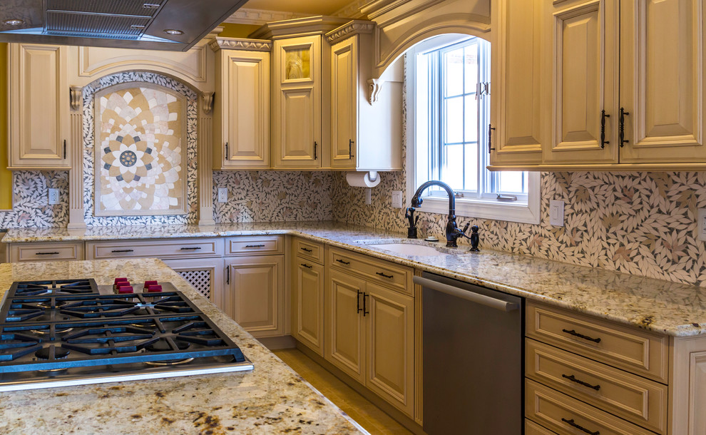 Inspiration for a large transitional kitchen remodel in Boston with an undermount sink, raised-panel cabinets, light wood cabinets, granite countertops, stainless steel appliances and an island