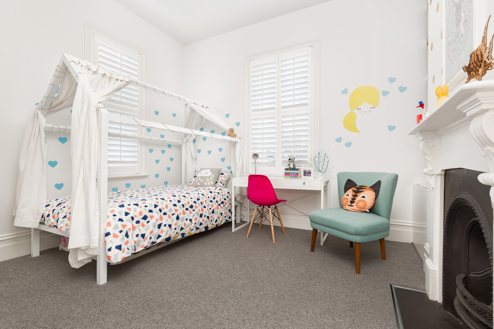 Photo of a scandinavian kids' bedroom for girls in Geelong with white walls, carpet and grey floor.