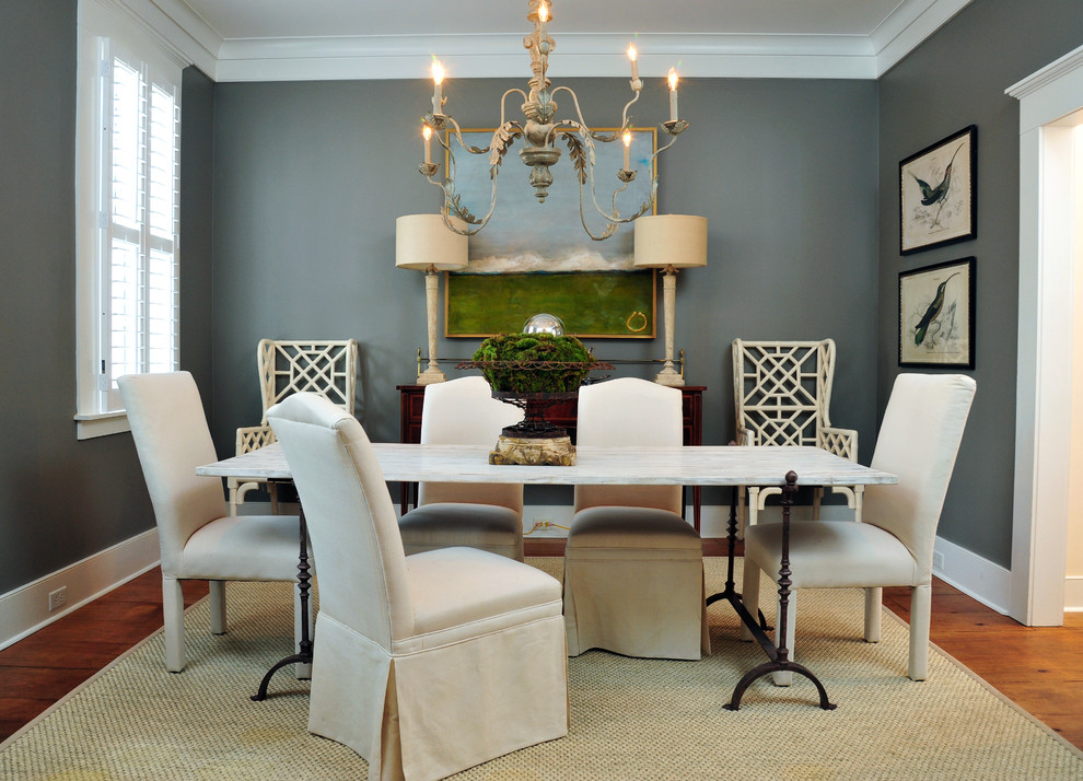 Mid-sized elegant medium tone wood floor enclosed dining room photo in Atlanta with gray walls