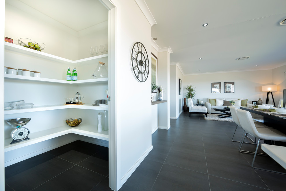 Inspiration for a large contemporary l-shaped open plan kitchen with an undermount sink, white cabinets, quartz benchtops, white splashback, window splashback, stainless steel appliances, ceramic floors, with island and brown floor.