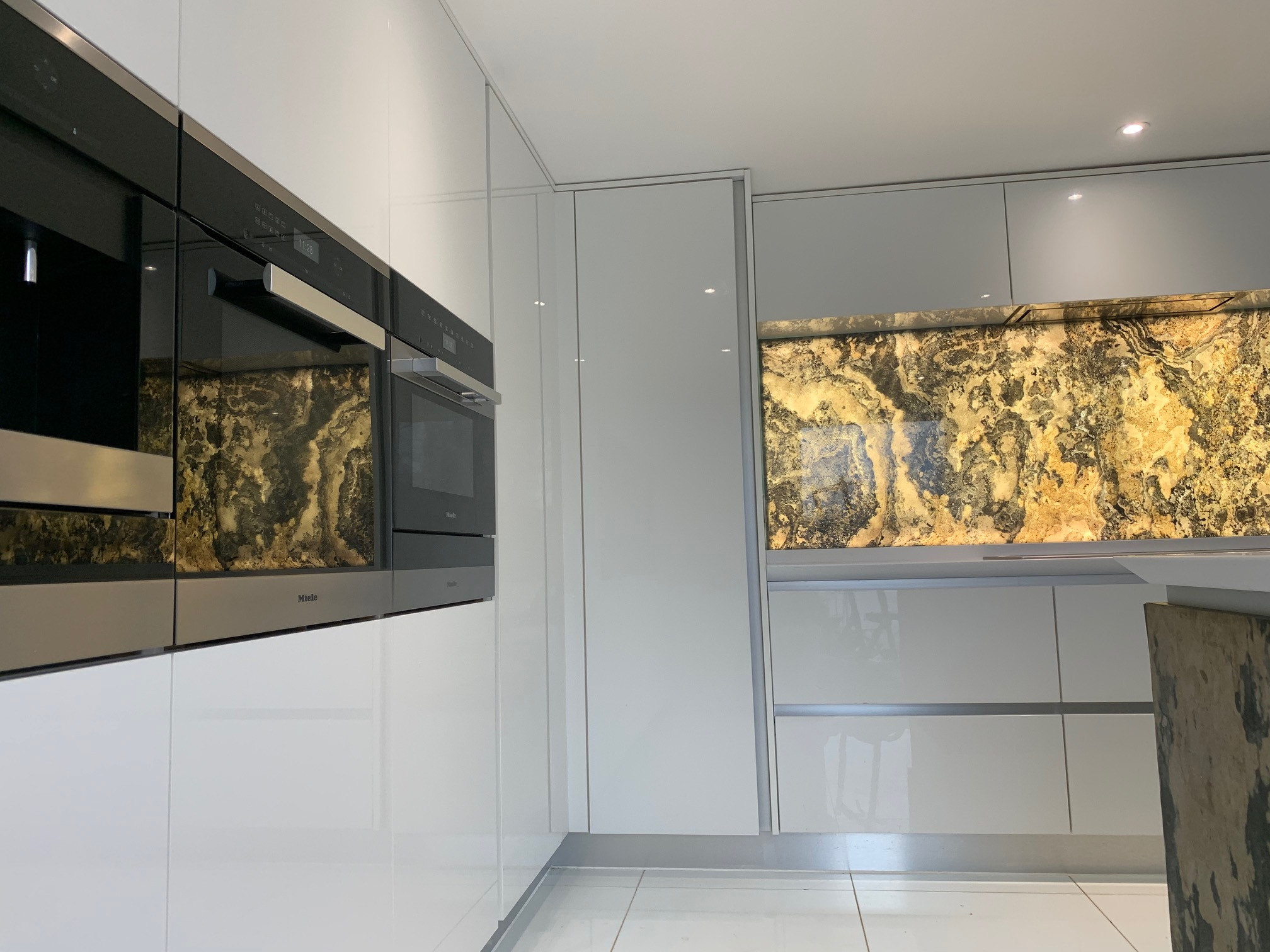Real Slate doors and illuminated splash back.