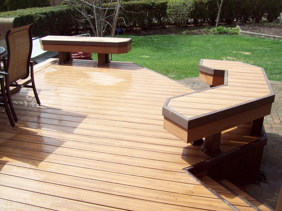 Photo of a mid-sized transitional backyard deck in Detroit with a fire feature and no cover.