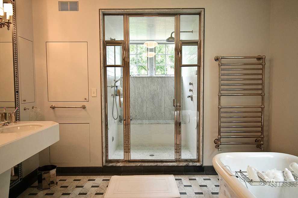 Traditional bathroom in Philadelphia with a freestanding tub and an alcove shower.