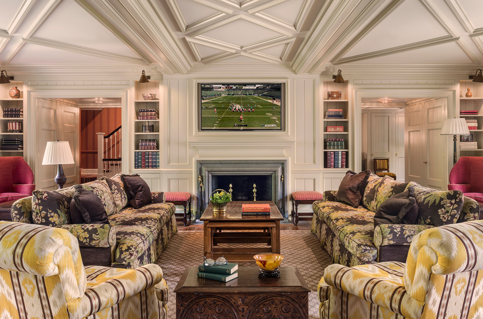 This is an example of a traditional family room in Philadelphia with white walls, dark hardwood floors, a standard fireplace, a stone fireplace surround and a wall-mounted tv.