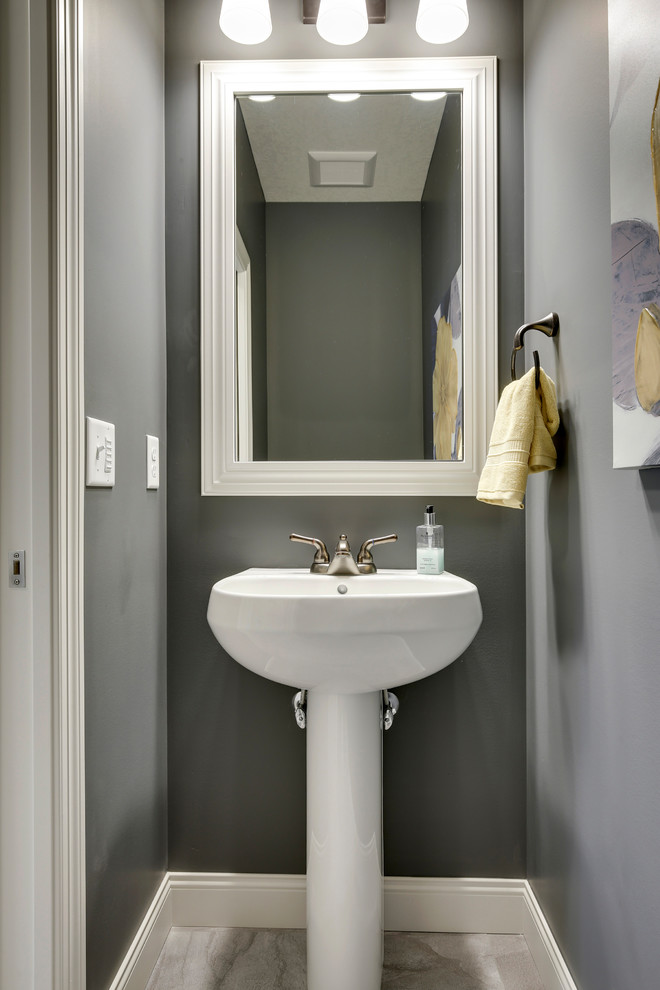 This is an example of a transitional powder room in Minneapolis.