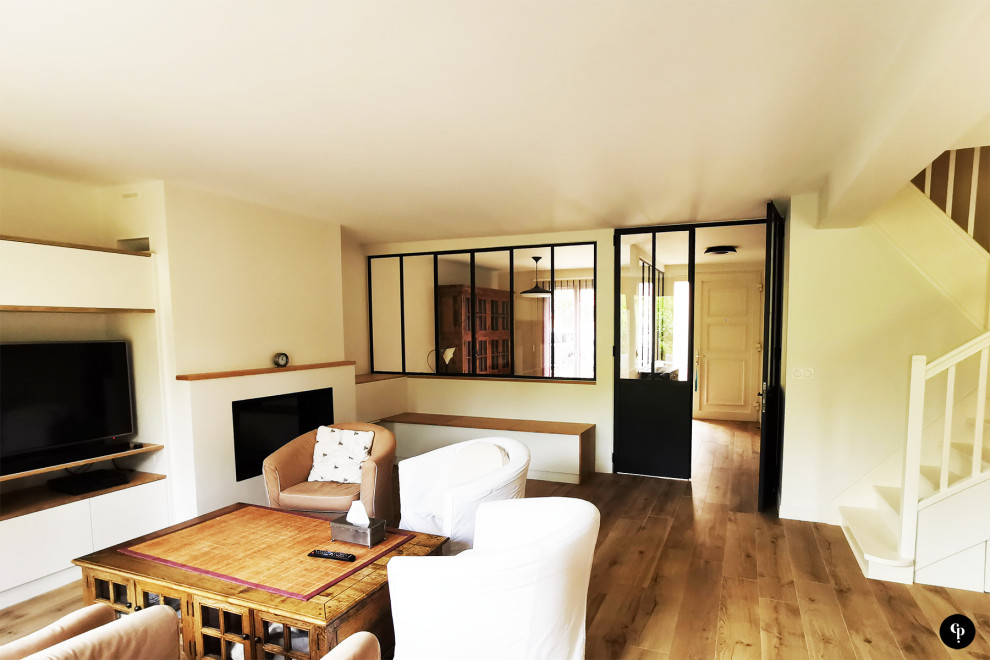 Photo of a large contemporary open plan games room in Paris with a home bar, beige walls, ceramic flooring, a standard fireplace, a built-in media unit and brown floors.