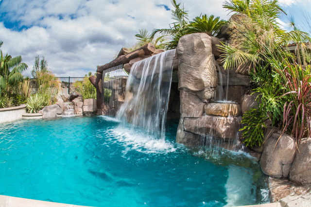 Tropical Beach Entry Pool & Spa with a Rock Slide & Grotto