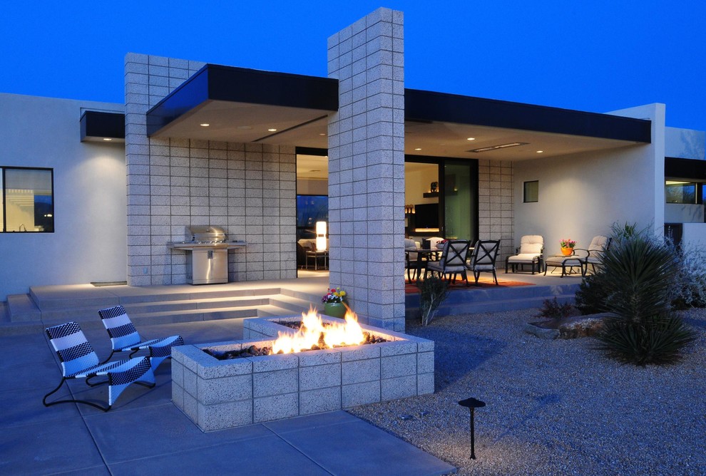 Design ideas for a contemporary patio in Phoenix with a roof extension.