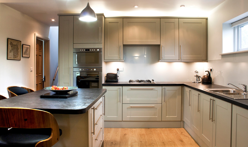 Medium sized modern kitchen in Surrey.