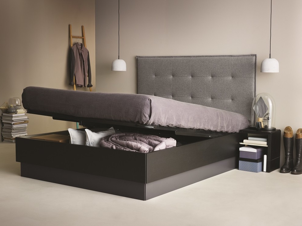 This is an example of a contemporary bedroom in Dusseldorf with beige walls and no fireplace.