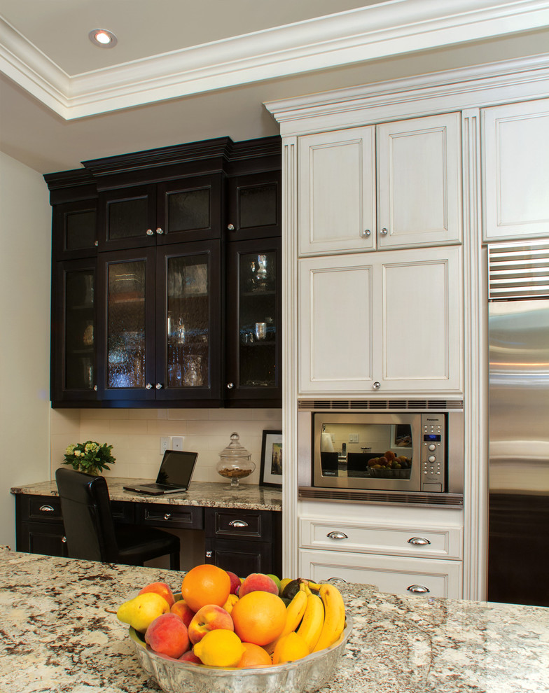 Example of a transitional kitchen design in Calgary