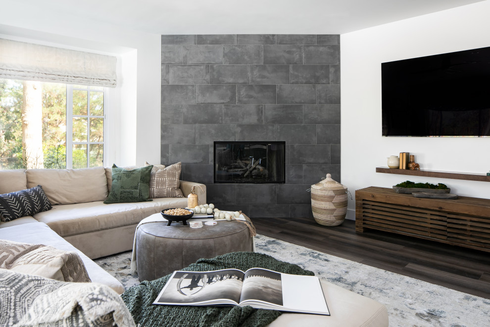 Inspiration for a mid-sized contemporary open concept vinyl floor and brown floor living room remodel in Orange County with white walls, a corner fireplace, a tile fireplace and a wall-mounted tv