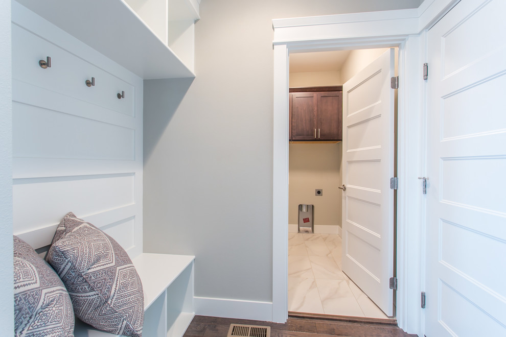 Small transitional dark wood floor mudroom photo in Seattle with gray walls