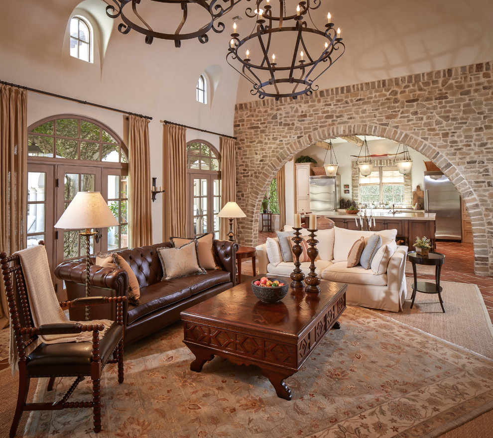 Mid-sized mediterranean formal enclosed living room in Houston with beige walls, terra-cotta floors, no fireplace, no tv and red floor.