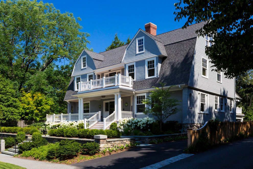 Inspiration for a large traditional three-storey grey exterior in Boston with wood siding, a gambrel roof and a shingle roof.