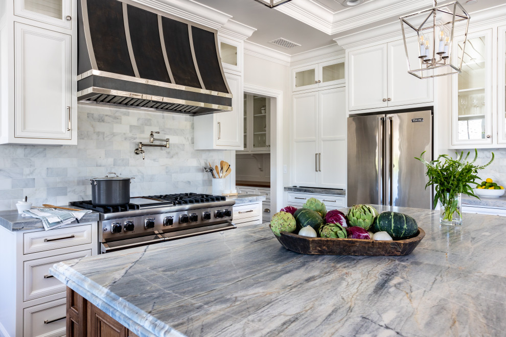 Eat-in kitchen - large traditional medium tone wood floor, brown floor and shiplap ceiling eat-in kitchen idea in Sacramento with an undermount sink, shaker cabinets, white cabinets, quartzite countertops, multicolored backsplash, marble backsplash, stainless steel appliances, an island and gray countertops