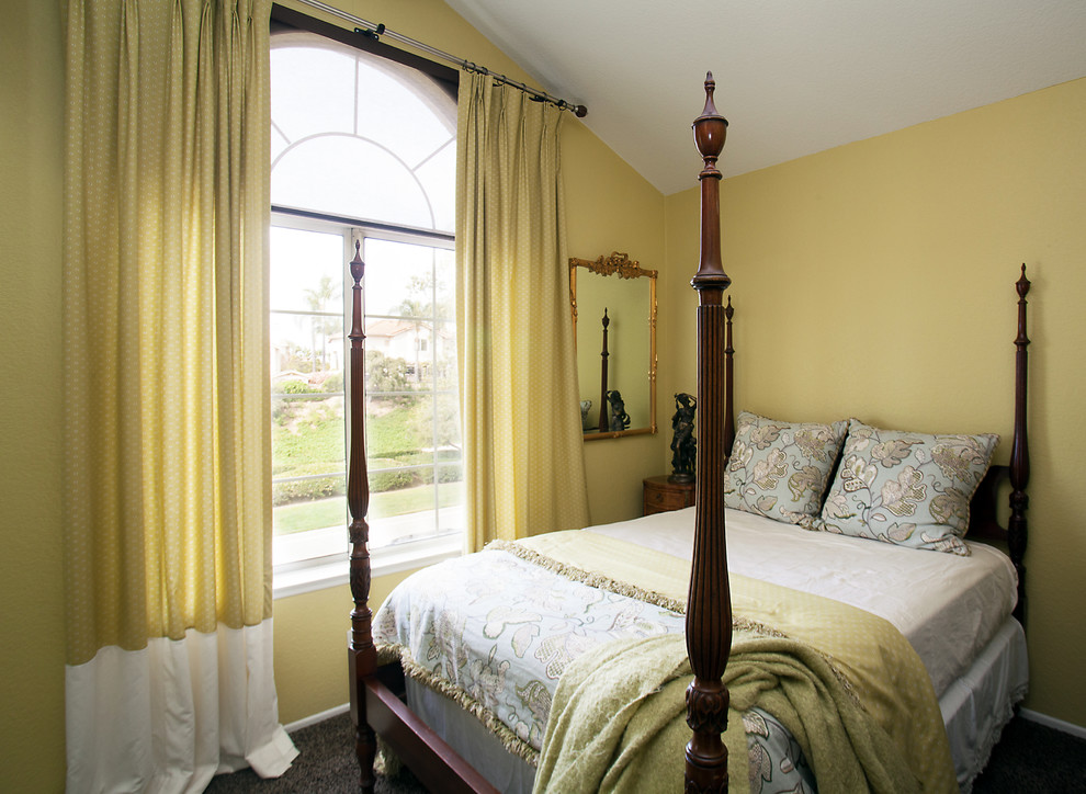 Photo of a small traditional guest bedroom in Orange County with green walls, carpet and no fireplace.