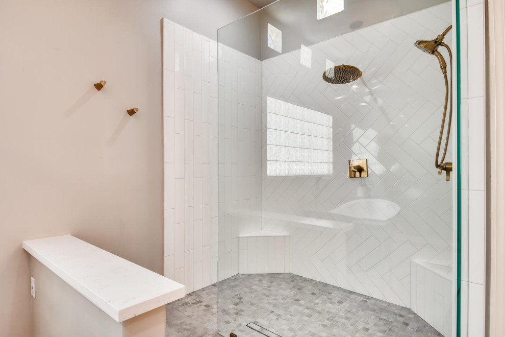 White subway tile with gold fixtures