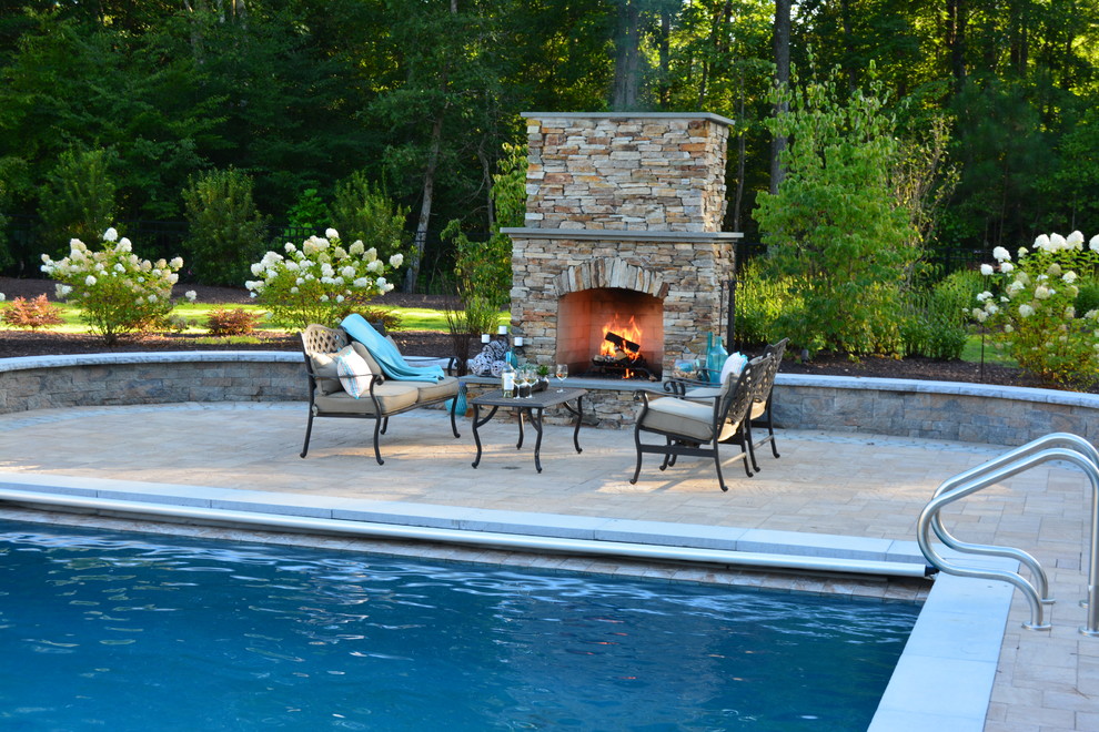 Design ideas for a large arts and crafts backyard patio in Richmond with a fire feature, concrete pavers and no cover.