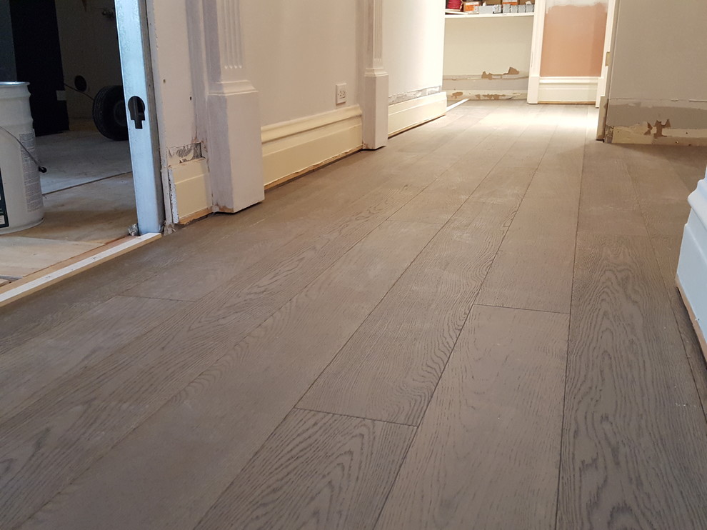 5 and 3/4 inch engineered Bed Rock Oak trowel glued and nailed