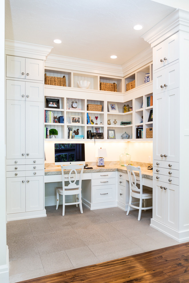 Photo of a traditional home office in Salt Lake City with a built-in desk and beige floor.