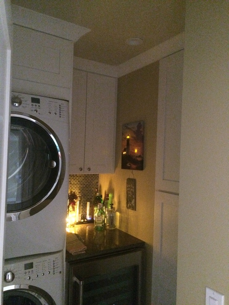 This is an example of a transitional laundry room in Other.