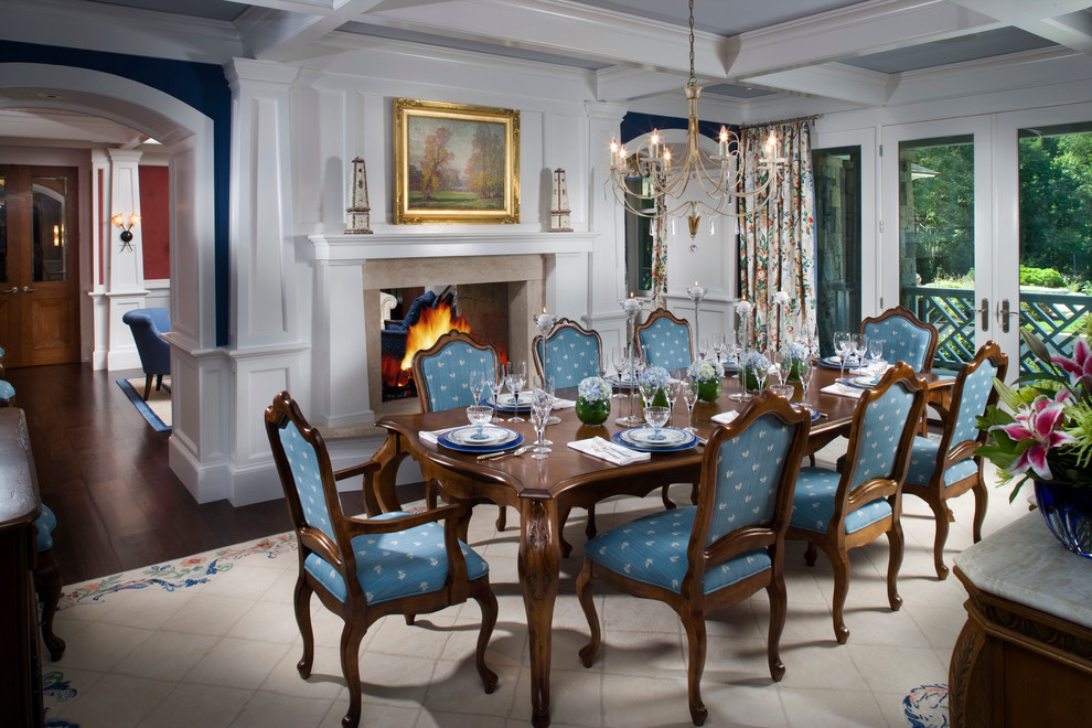 Photo of a mid-sized traditional separate dining room in Boston with blue walls, dark hardwood floors and a two-sided fireplace.