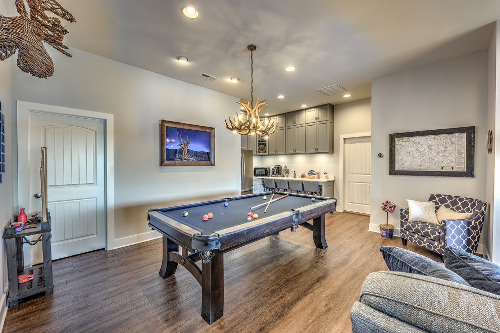 Inspiration for a large traditional enclosed games room in Atlanta with a game room, beige walls, vinyl flooring, a wall mounted tv and brown floors.