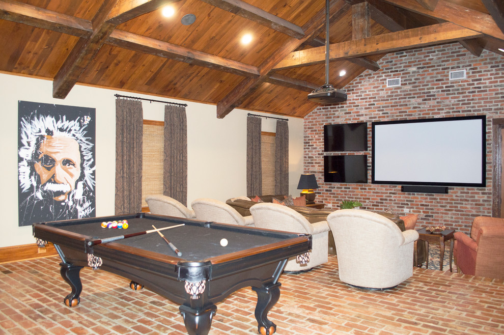 Photo of a large traditional open concept family room in New Orleans with a game room, beige walls, brick floors, a wall-mounted tv and brown floor.