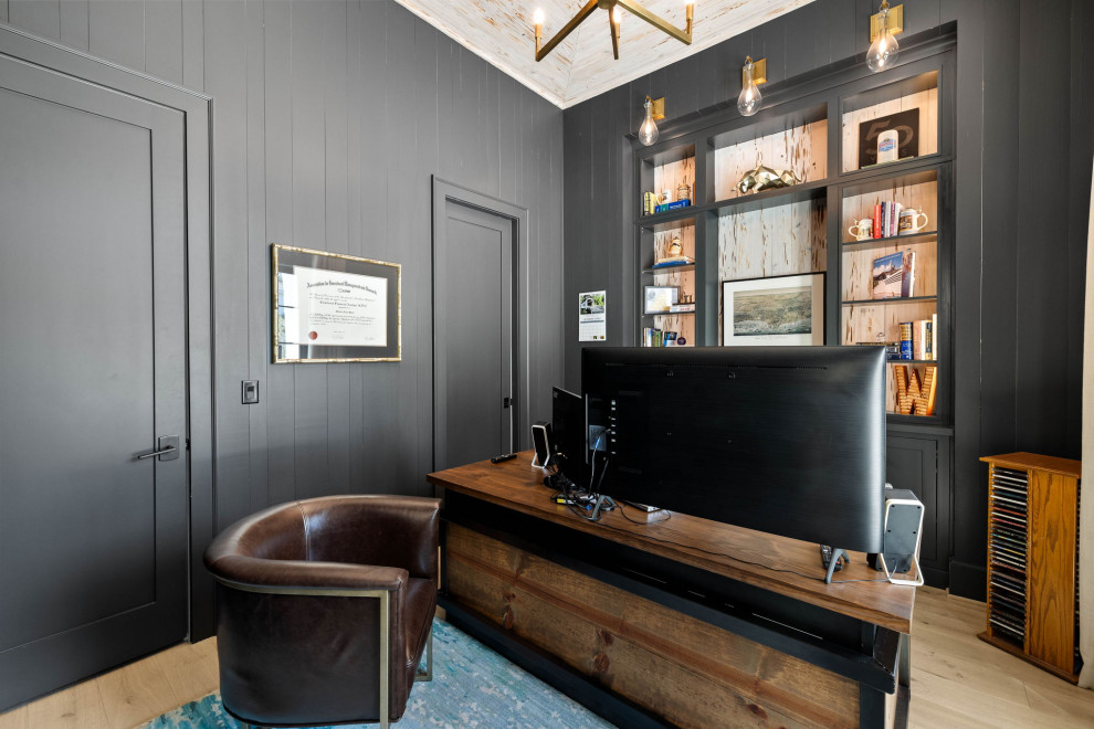 Medium sized coastal home office in Other with black walls, light hardwood flooring, a freestanding desk, a wood ceiling and wood walls.