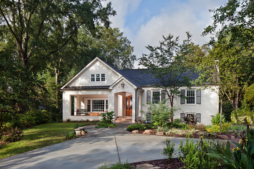 Mid-sized traditional two-storey white exterior in Charlotte with a gable roof.