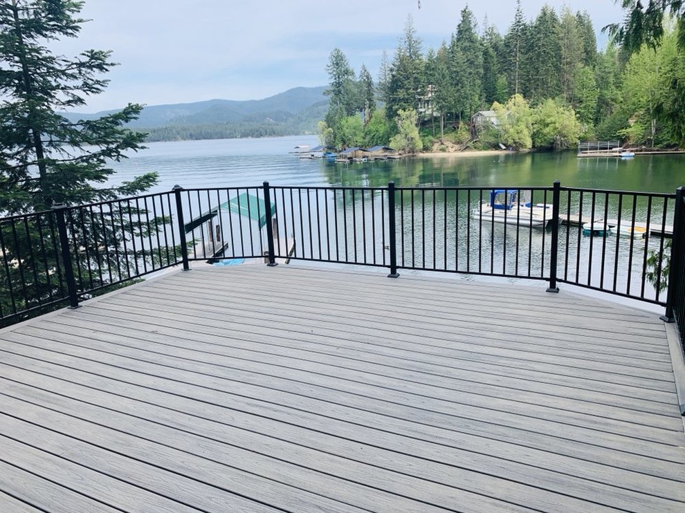 Example of a mid-sized classic backyard deck design in Seattle with no cover