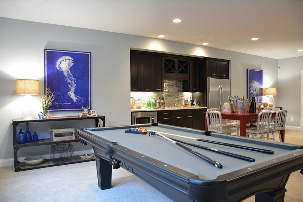 Example of a transitional underground carpeted basement design in Indianapolis with gray walls and no fireplace