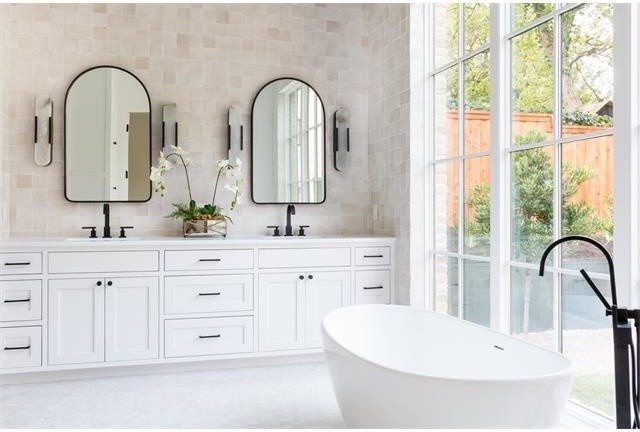 Inspiration for a large transitional master beige tile and cement tile porcelain tile and white floor bathroom remodel in Austin with shaker cabinets, white cabinets, white walls, an undermount sink and white countertops