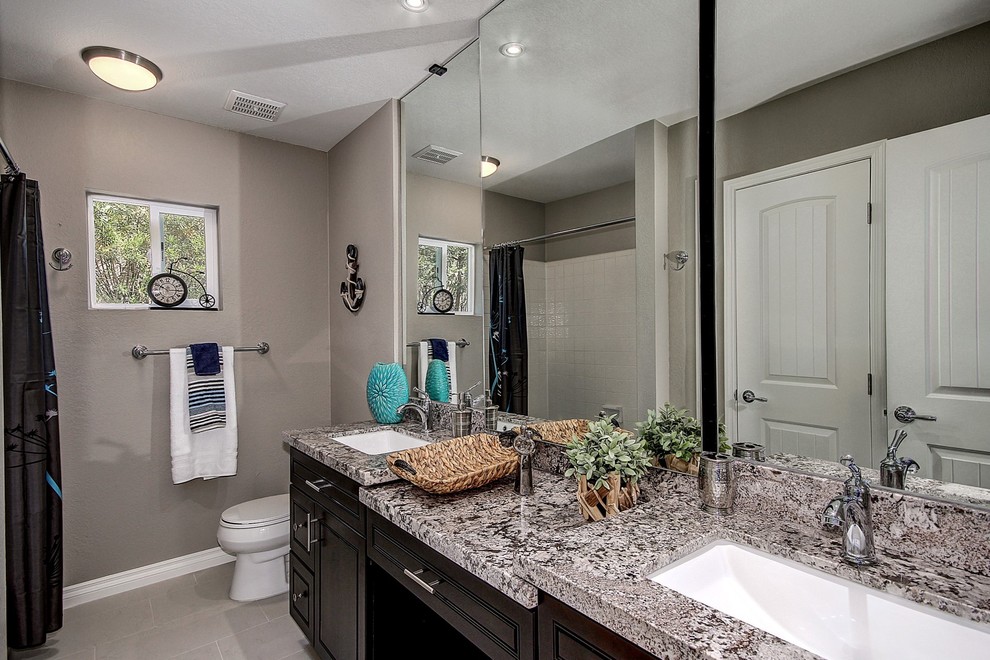 Example of a mountain style home design design in Phoenix