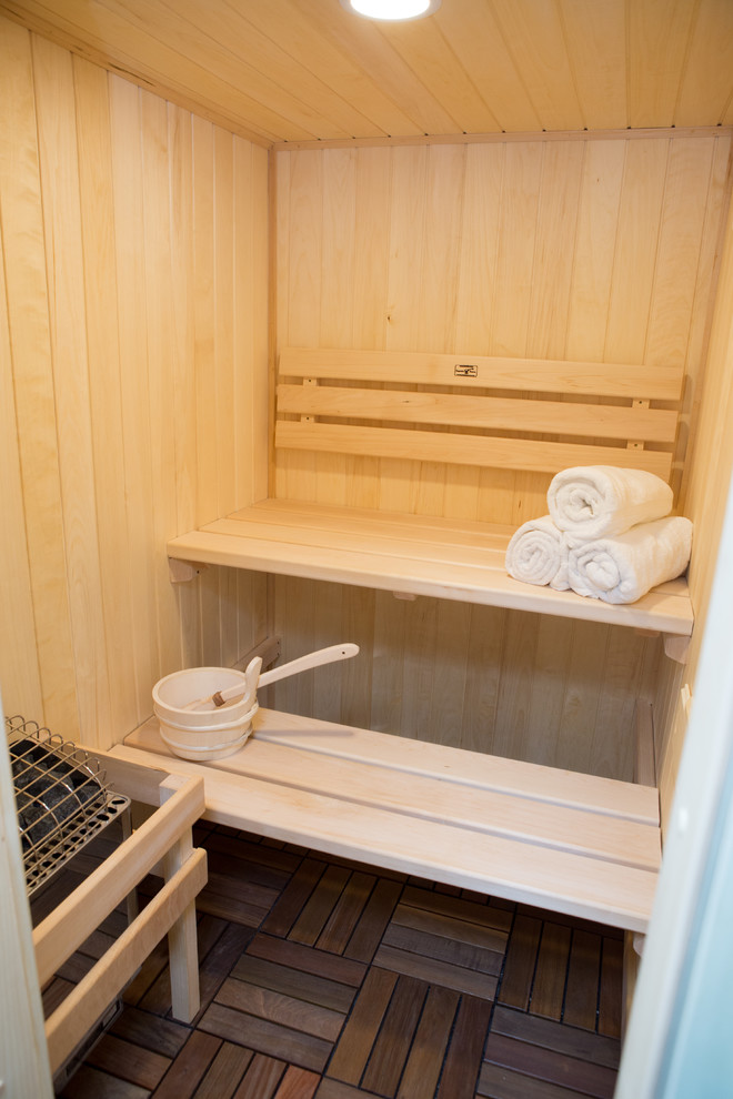 Home gym - large transitional medium tone wood floor and brown floor home gym idea in Chicago