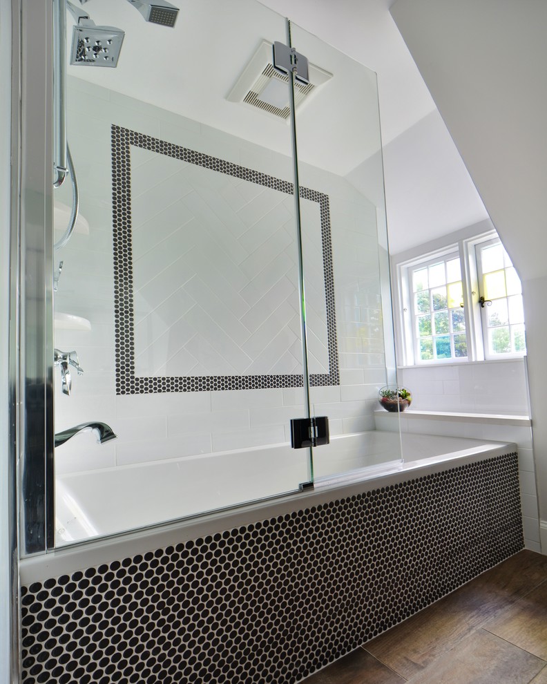 Example of a mid-sized transitional kids' gray tile and porcelain tile porcelain tile alcove bathtub design in Boston with an undermount sink, flat-panel cabinets, gray cabinets, quartz countertops, a one-piece toilet and gray walls