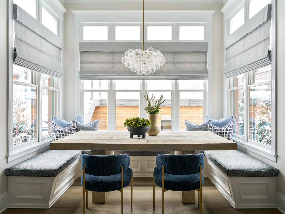 Inspiration for a mid-sized transitional light wood floor breakfast nook remodel in Chicago