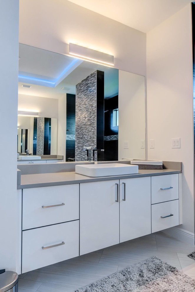 Design ideas for a large contemporary master bathroom in Other with flat-panel cabinets, white cabinets, an open shower, black and white tile, glass tile, grey walls, a vessel sink, engineered quartz benchtops, grey floor, an open shower and grey benchtops.