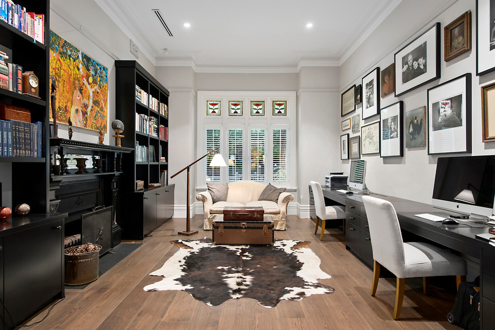 Design ideas for a transitional home office in Melbourne with grey walls, dark hardwood floors and a freestanding desk.