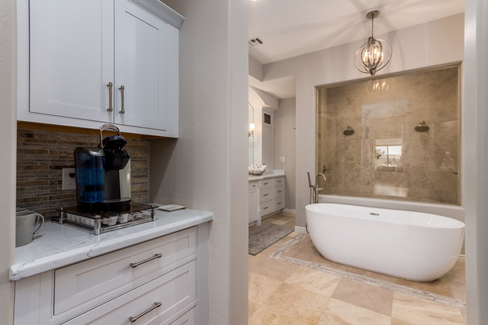Example of a large transitional master travertine floor and beige floor freestanding bathtub design in Phoenix with beaded inset cabinets, white cabinets, quartz countertops and white countertops
