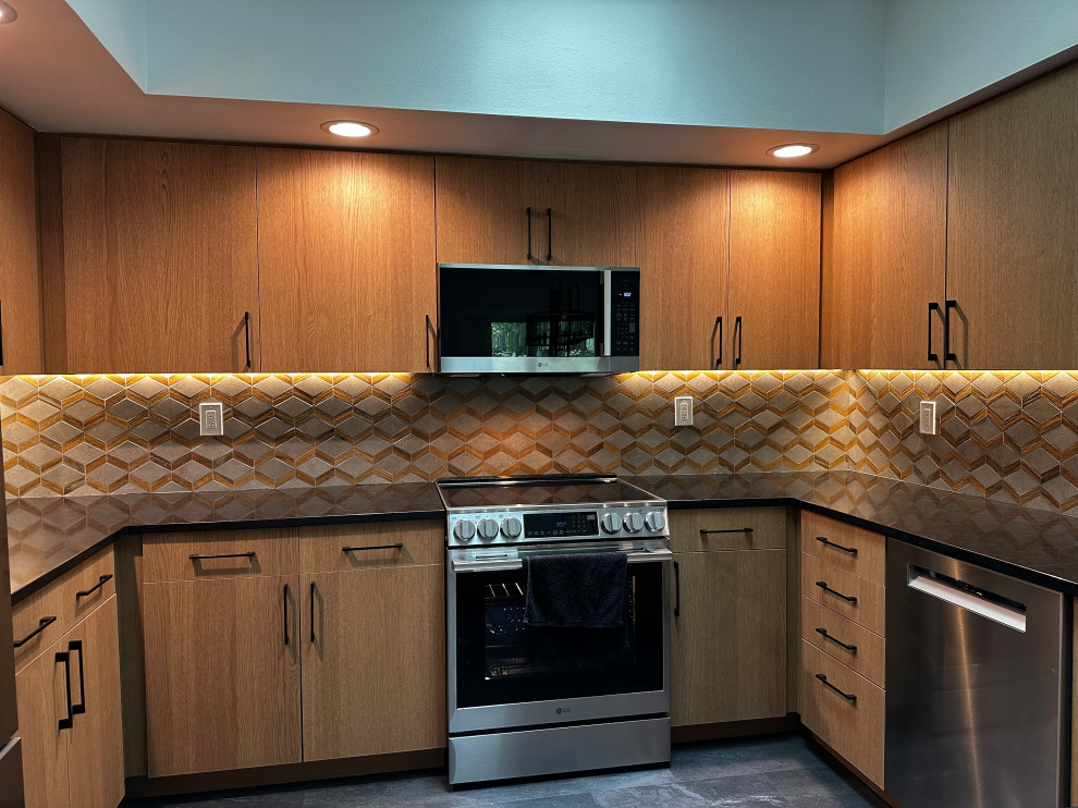 Inspiration for a small eclectic u-shaped vinyl floor, gray floor and vaulted ceiling kitchen pantry remodel in Seattle with a double-bowl sink, flat-panel cabinets, brown cabinets, quartz countertops, brown backsplash, porcelain backsplash, stainless steel appliances, a peninsula and black countertops