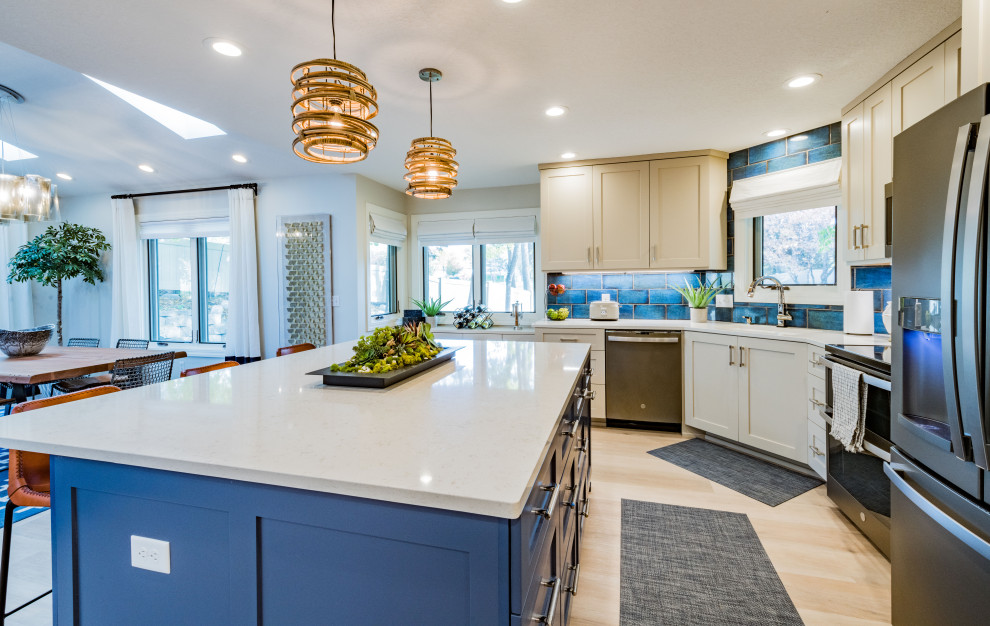 Small traditional l-shaped open plan kitchen in Minneapolis with a submerged sink, shaker cabinets, blue cabinets, quartz worktops, blue splashback, ceramic splashback, coloured appliances, vinyl flooring, an island, beige floors and white worktops.