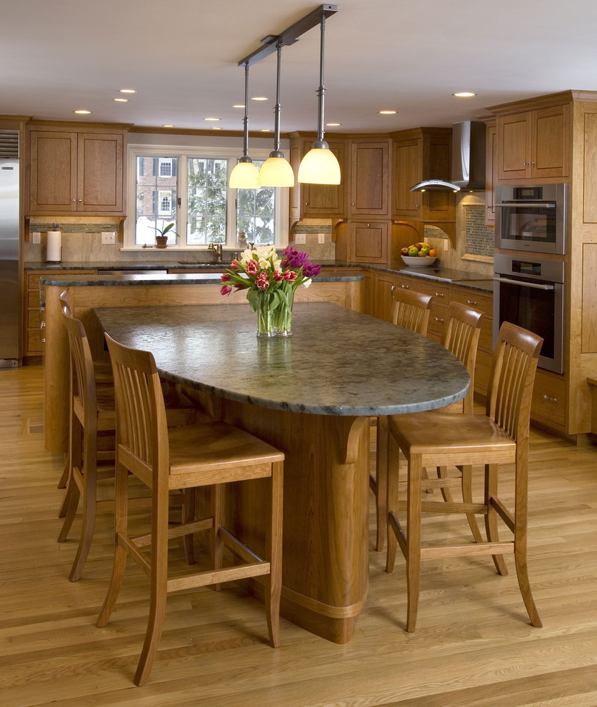 This is an example of a contemporary kitchen in Boston with shaker cabinets and stainless steel appliances.