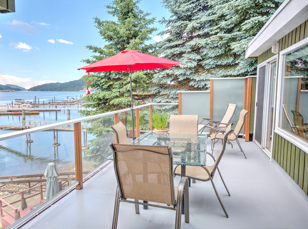 Photo of a traditional rooftop and first floor deck in Vancouver with with dock and no cover.