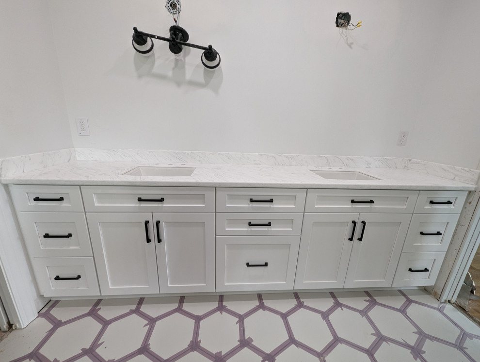 Inspiration for a mid-sized master white floor and double-sink bathroom remodel with flat-panel cabinets, white cabinets, solid surface countertops, white countertops and a built-in vanity