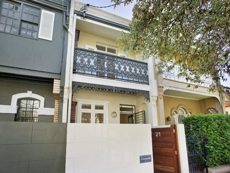 Photo of a small contemporary two-storey brick beige exterior in Sydney with a hip roof.